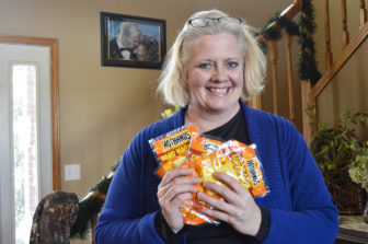 Shelle Aberle of Bismarck donates hand warmers to law enforcement.