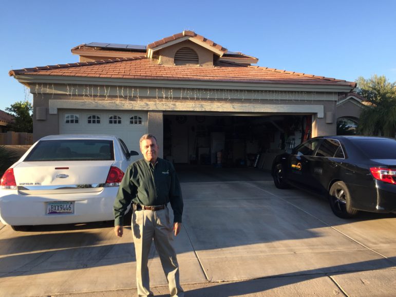 Charlie Miller stands in front of his home in the retirement community of Pebble Creek, west of Phoenix. Miller is one of the many republicans who have embraced solar in Arizona. 