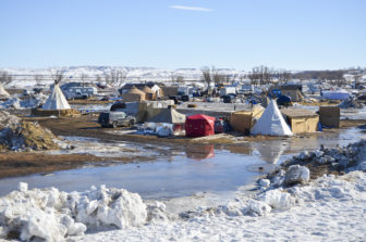 The winter's heavy snowfall is already causing flooding at camp. Rising water levels from the nearby Missouri and Cannonball rivers will soon follow.