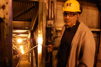 Sheldon Station Plant Manager Chris Cerveny shows the conveyor where coal is brought into the plant twice a day.
