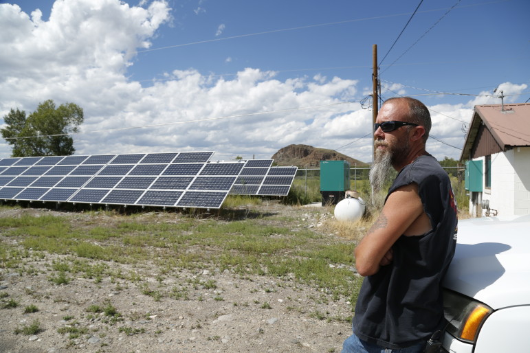 In Del Norte, CO, the Public Works Supervisor Kevin Larimore shows off an array of solar panels that provide electricity for the town's water supply. 