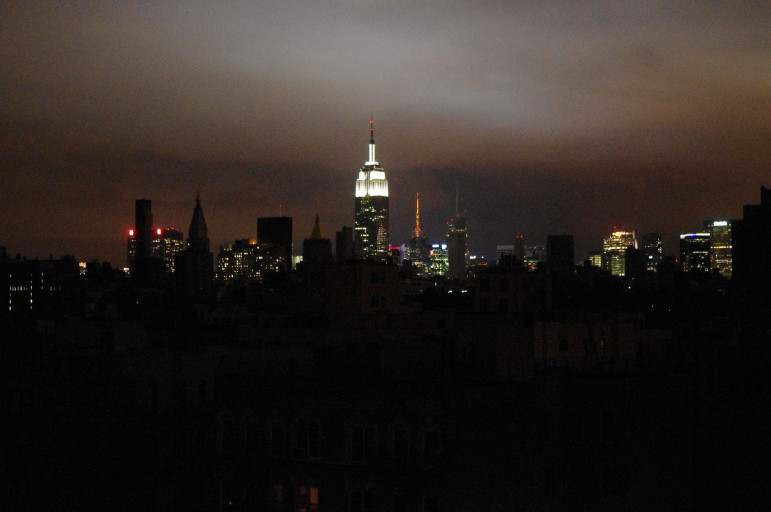 Midtown New York skyline with the Empire State Building in the background (with electricity), in the foreground is Alphabet City and the East Village without power, Tuesday night, November 30, 2012, after Hurricane Sandy.