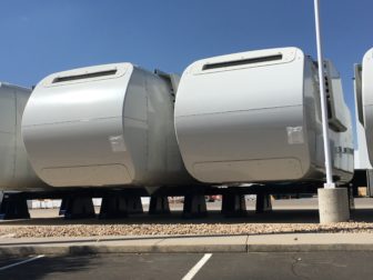 Nacelles, manufactured by Vestas, lined up outside of the company's Brighton, CO facility.